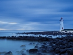 beautiful lighthouse on a rocky shore