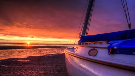 beached sailboat at sunset - people, beach, sunset, sea, ripples, sailboat