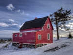 wonderful red farmhouse in winter