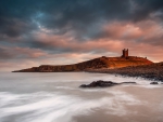 castle ruins at the town of craster in northern england