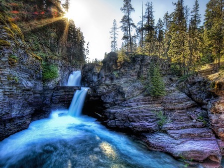 canyon waterfalls - pine trees, sun light, deep canyon walls