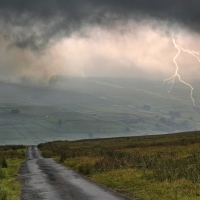 lightning with rain clouds over the valley