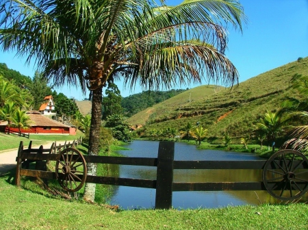 Lago - hills, summer, beautiul, grass, lago, mountain, countryside, shore, lake, nice, place, sky, house, palms, pond, lovely, nature