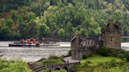 tour boat passing a wonderful scottish castle - river, boat, forest, castle, tourists, bridge