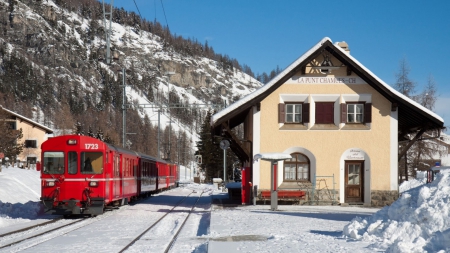 train in a station in la punt chamues in the swiss alps - train, staion, mountain, red, winter, tracks