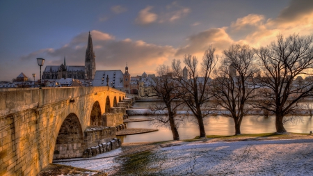 beautiful stone bridge in regensburg germany in winter - trees, winter, town, clouds, snow, river, cathedral, bridge, danube river