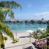 Beach and Blue Lagoon overlooking Water Bungalows Bora Bora