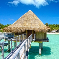 Beautiful Water Bungalow over clear green blue lagoon Bora Bora