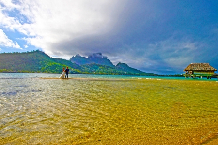 Wedding Couple on shallow Lagoon - Bora Bora French Polynesia - pacific, paradise, vows, yellow, married, shallow, south, marriage, islands, tropical, ceremony, beautiful, waters, sea, retreat, woman, beach, water, polynesia, french, bora bora, man, atoll, lagoon, sand, ocean, wedding, couple, honeymoon, exotic, luxury, blue, island, tahiti