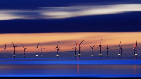 row of turbine windmill on the horizon at sunset - windmills, horizon, clouds, turbines, sunset, sea