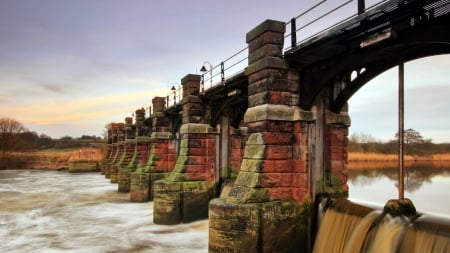 flood control bridge on a river in wales - river, water control, stone pillars, bridge