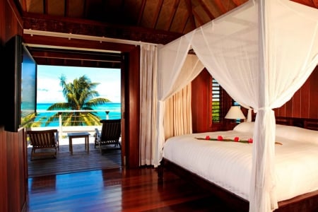 Beach Villa Four Poster bed at Bora Bora tahiti - lagoon, blue, beach, room, island, polynesia, interior, tahiti, villa, bed, bungalow, atoll, hotel, luxury, water, sea, four poster, bedroom, ocean, suite, islands, tropical, bora bora, modern, contemporary