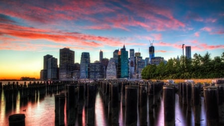 wonderful view of downtown manhattan - clouds, pylons, skyscrapers, city, harbor, sunset