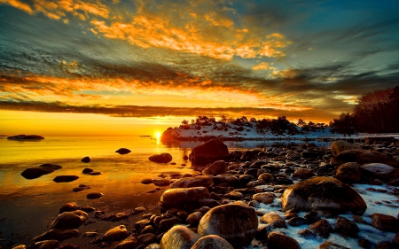 Snowy rocky shore - nice, beauty, sky, beach, water, synset, mirrored, shine, coast, rocks, calm, quiet, reflection, clouds, golden, snowy, sands, ocean, sunlight, light, shore, lovely, serenity, nature, glow, beautiful, stones, sunrise, sea