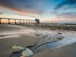 wonderful pier on a beach with the tide out