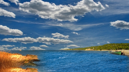 boat docked at a windy seashore - dock, inlet, shore, wind, clouds, hdr, grass, sea, boat