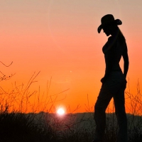 Cowgirl in the sunset