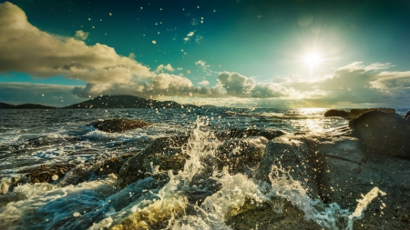 ocean spray at a rocky shore - spray, sun, clouds, shore, sea, rocks