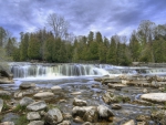 beautiful wide waterfall in a rocky river