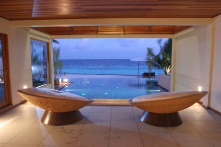 View over lit Pool to Ocean