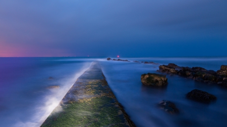 cement wharf in a misty sea at dusk - dusk, lights, rocks, sea, wharf, mist