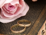 One Pink Rose with Two Wedding Rings