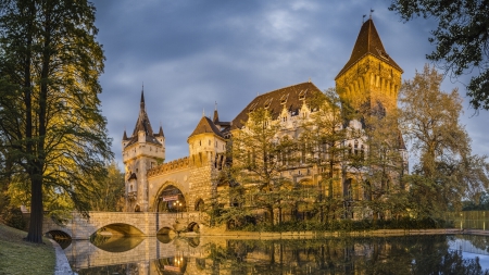 wonderful vajdahunyad castle in budapest - trees, pond, towers, castle, bridge