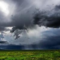 rain clouds over fields