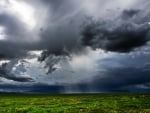 rain clouds over fields