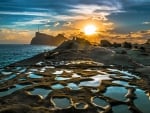 sunset over tidal pools on seacoast