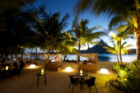 Tropical Dinner by Candlelight - beach, island, polynesia, tahiti, dinner, holiday, dine, view, dining, exotic, paradise, candles, sea, resort, ocean, candlelight, islands, sunset, tropical, bora bora, lights, dusk, restaurant