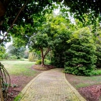 stone arch over path in a garden