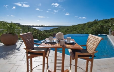 Chairs by a Beautiful Pool - table for two, infinity, lagoon, blue, beach, chairs, sea, island, ocean, islands, tropical, pool, view, exotic, paradise