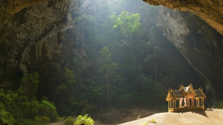 temple inside a huge grotto - temple, sun rays, forest, grotto