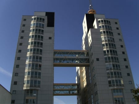 2 buildings - white, glas, blue sky, stockholm