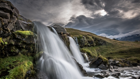 wonderful waterfall in iceland - rocks, clouds, waterfall, spray, grass