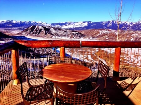 Gorgeous backyard of log cabin in Idaho - house, snow, patio, mountain