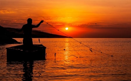 Fisherman at Sunset - water, sunset, landscape, fisherman