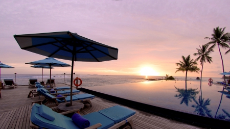 infinity pool on a beach at sunset - beach, terrace, sunset, pool, sea