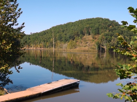 The Dock - trees, hills, water, blue, green, brown, dock, sky