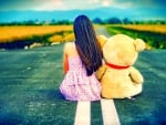 Girl and teddy bear