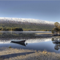 boat on a lake on a frosty winter day hdr