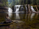 rock tower in front of a gorgeous waterfall