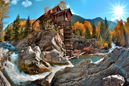 Crystal mill - sunny, creek, crystal, mountain, cliffs, nice, sky, sun, trees, water, beautiful, mill, lovely, fall, dazzling, glow, river, nature, rays, autumn, rocks