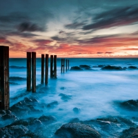 broken wooden fence in seashore