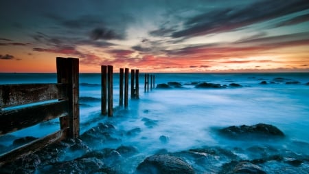 broken wooden fence in seashore - clouds, shore, sunset, broken, sea, fence