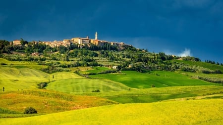 beautiful pienza in tuscany - hill, dark sky, town, fields