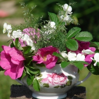 Cup with summer flowers