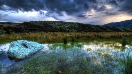 swamp under stormy sky - clouds, rock, swamp, grass, mountains