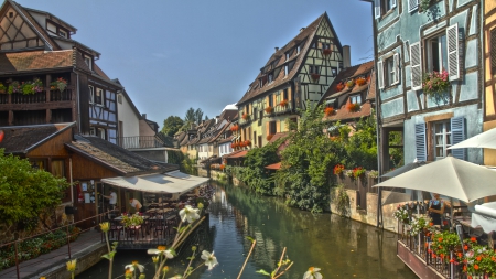 colmar in alsace france called little venice - flowers, canal, restaurants, town